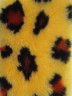 Искусственный мех ( желтый с бордовыми пятнами) 